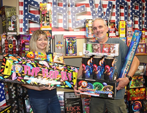 Fireworks are fun! Becky White and Castle of Muskogee Co-owner Matt Hiller show off a few of the new 2024 fireworks. Value News Magazine & Values, Inc. photo, June 2024.