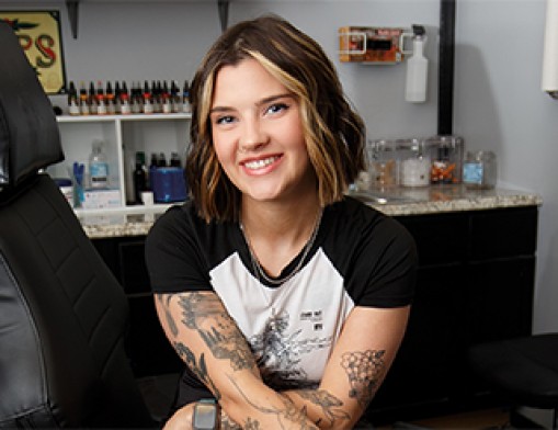 Lexi Odam at Renegade’s Top Hat Tattoos has the skills and talent to ink your story. Value News Magazine & Values, Inc photos, March 2025.