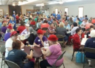 Bunco players compete to win prizes and raise money for local charities.