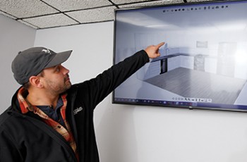 Austin Gullic demonstrates Premium Cabinets 3-D design services.
Value News & Values Inc. photo, 2023.