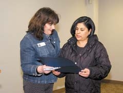 Gabriela Hernandez, an RCLC adult learner, receives a certificate of accomplishment from Mary Bowers, representing Congressman Dan Boren’s office. Hernandez has been an RCLC student since July, 2008.