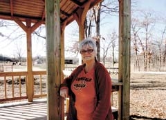 Debbie Hunter in front of the wedding gazebo.